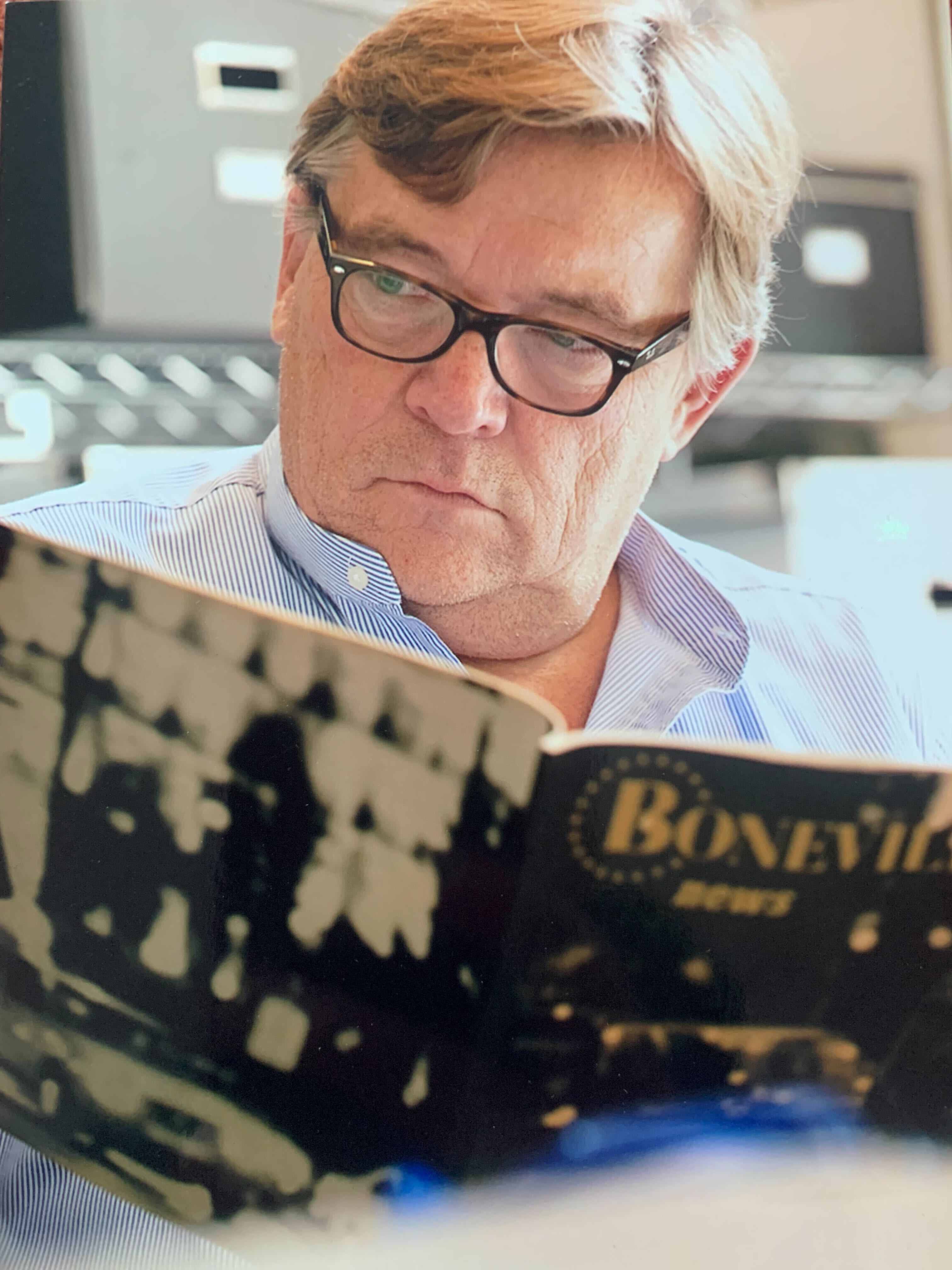 John holding a Boneville book